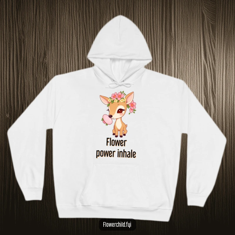 Funny cozy hoodie depicting a curious deer with a flower garland, investigating a large, beautiful flower.