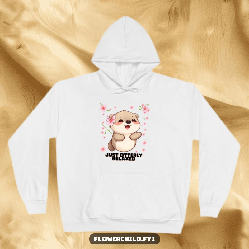 Funny otter hoodie showing a content otter with a flower, floating calmly in a sea of soft petals.